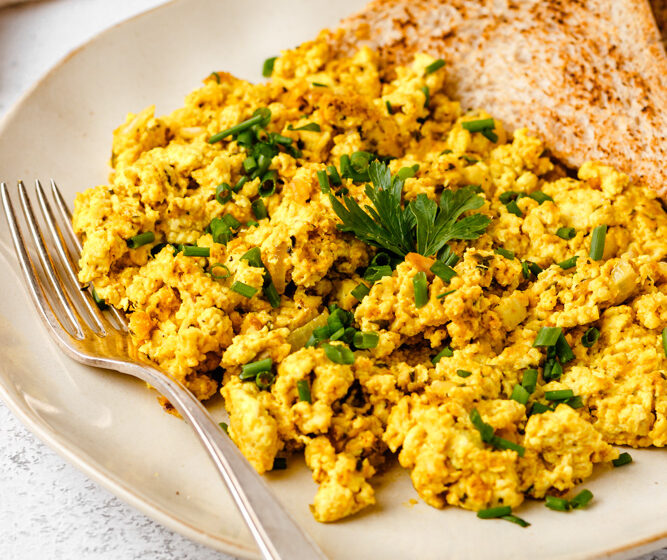 Tofu Scramble With Chives And Toast On A Plate