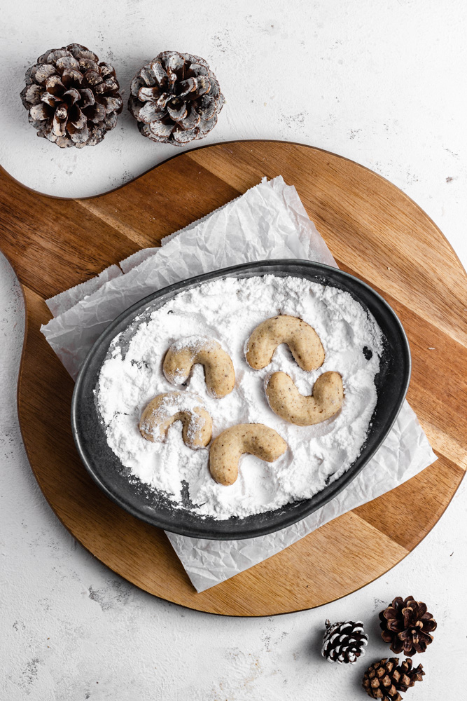 Warm crescent cookies in powdered sugar
