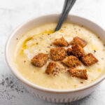 Close Up Of Garlic Potato Soup With Bread Croutons