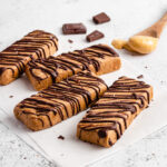 Four Peanut Butter Protein Bars On Parchment Paper