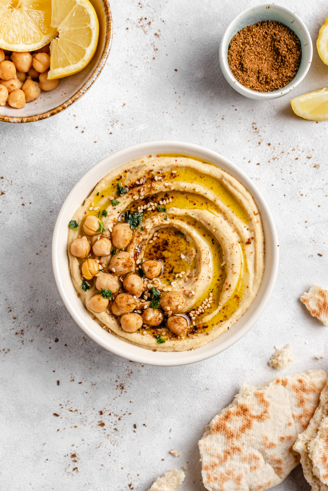 Headshot Of Smooth Hummus Topped With Chickpeas And Olive Oil