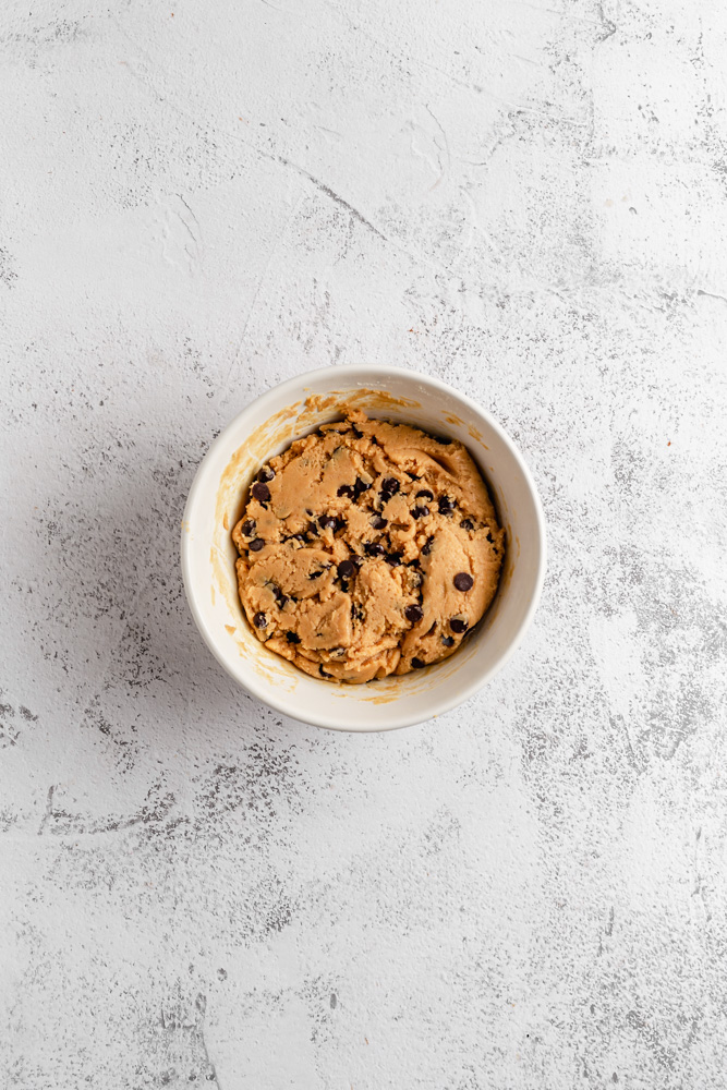 Peanut butter chocolate chip cookie dough in mixing bowl