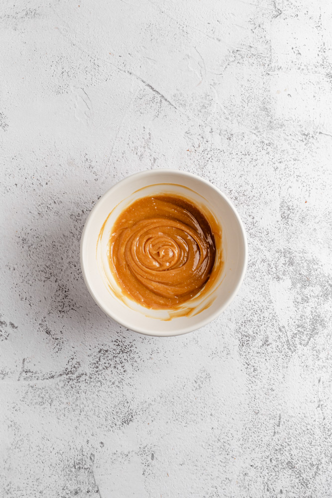 Salted peanut butter caramel in a mixing bowl