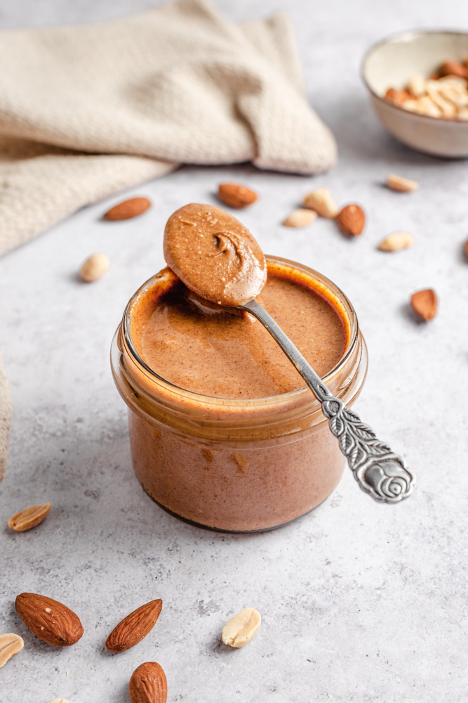 Banana bread nut butter in a jar with a spoon