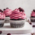 Chocolate cupcakes decorated with blackberry froting