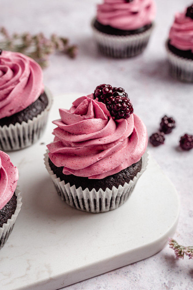 Blackberry chocolate cupcakes decorated with fresh blackberries