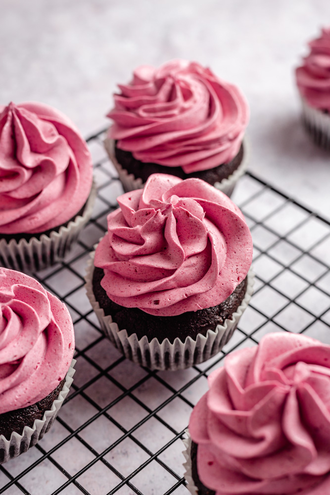 Chocolate cupcakes decorated with blackberry froting
