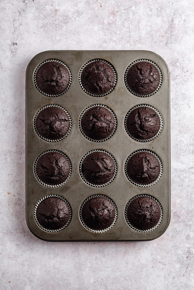 Chocolate cupcakes in a pan after baking