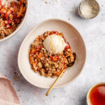 Nectarine crisp topped with a vegan ice cream